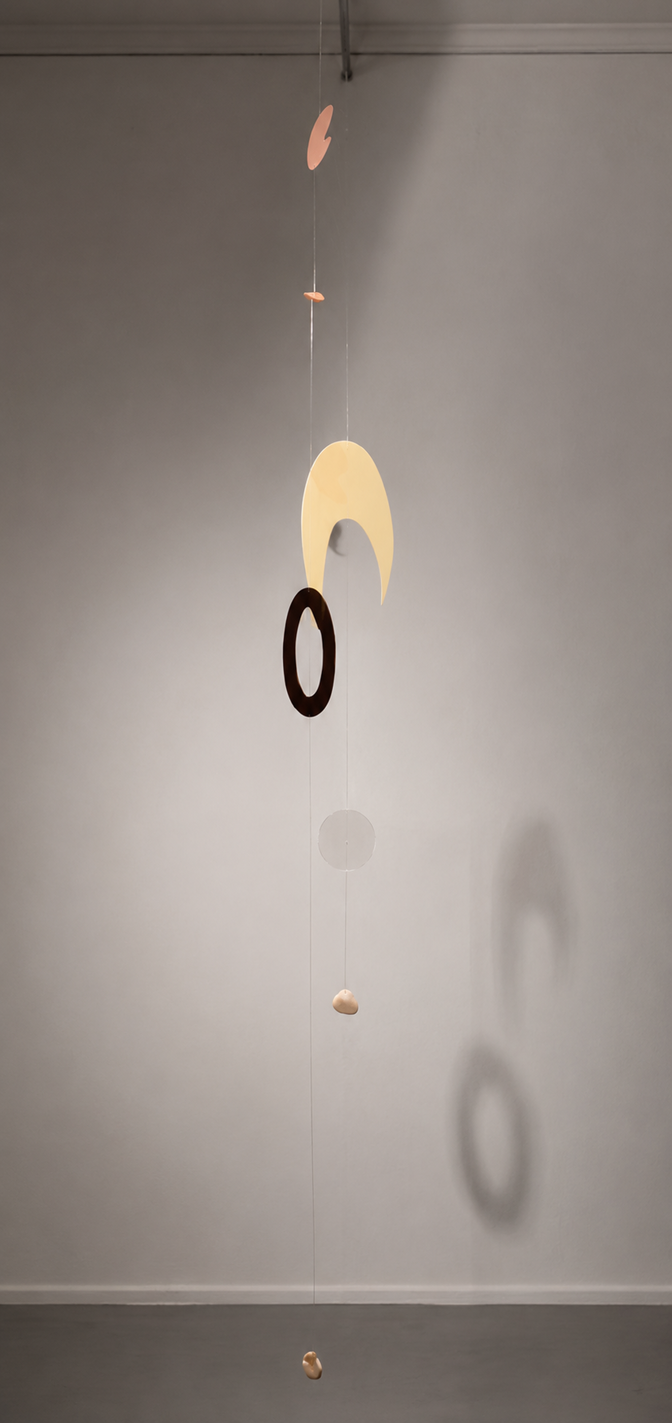 Hanging sculptural mobile installed in the gallery